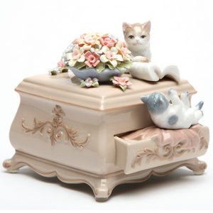 Porcelain musical Cats on dresser with flowers