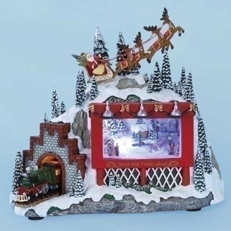 Santa and Reindeer over lighted scene with train