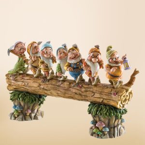 Seven Dwarfs on log Jim Shore